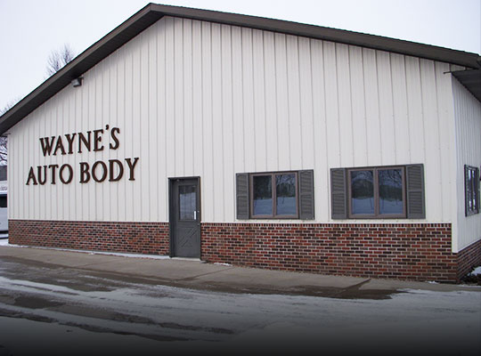 Front entrance of Wayne's Auto Body shop in Le Center, MN