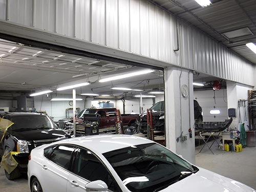 Inside the work bays at Wayne's Auto Body Shop in Le Center, Minnesota